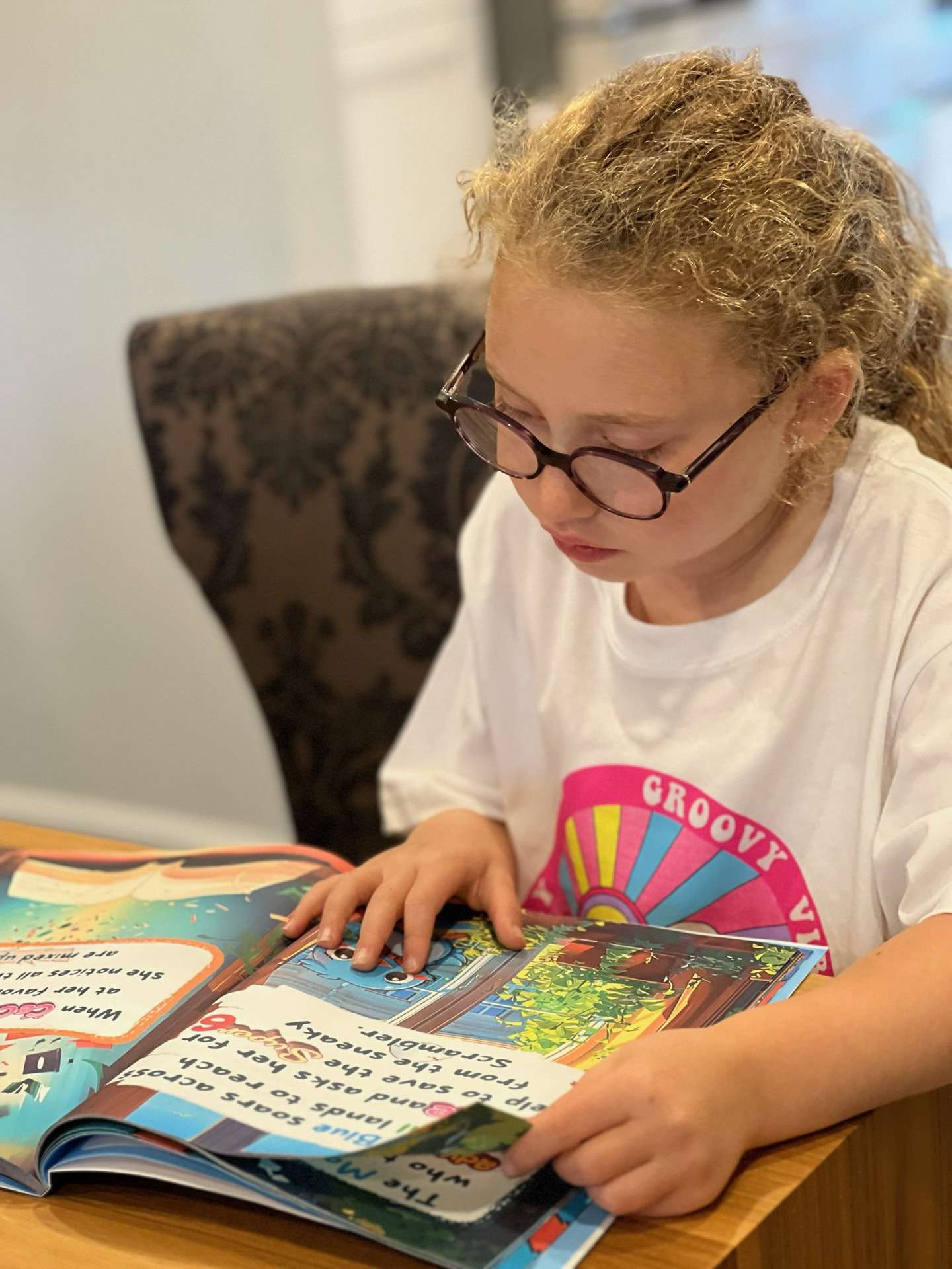 Child reading a CeCe and the Super 6 book