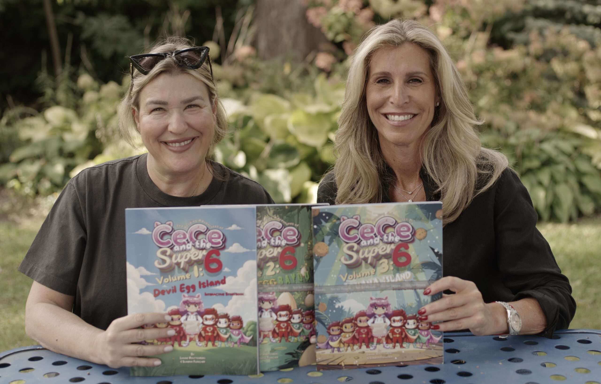 Shawna and Lianne holding the CeCe and the Super 6 book series